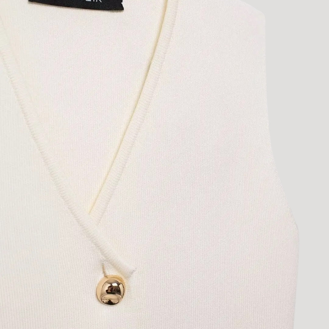 Matchande set dam – väst med plisserad kjol