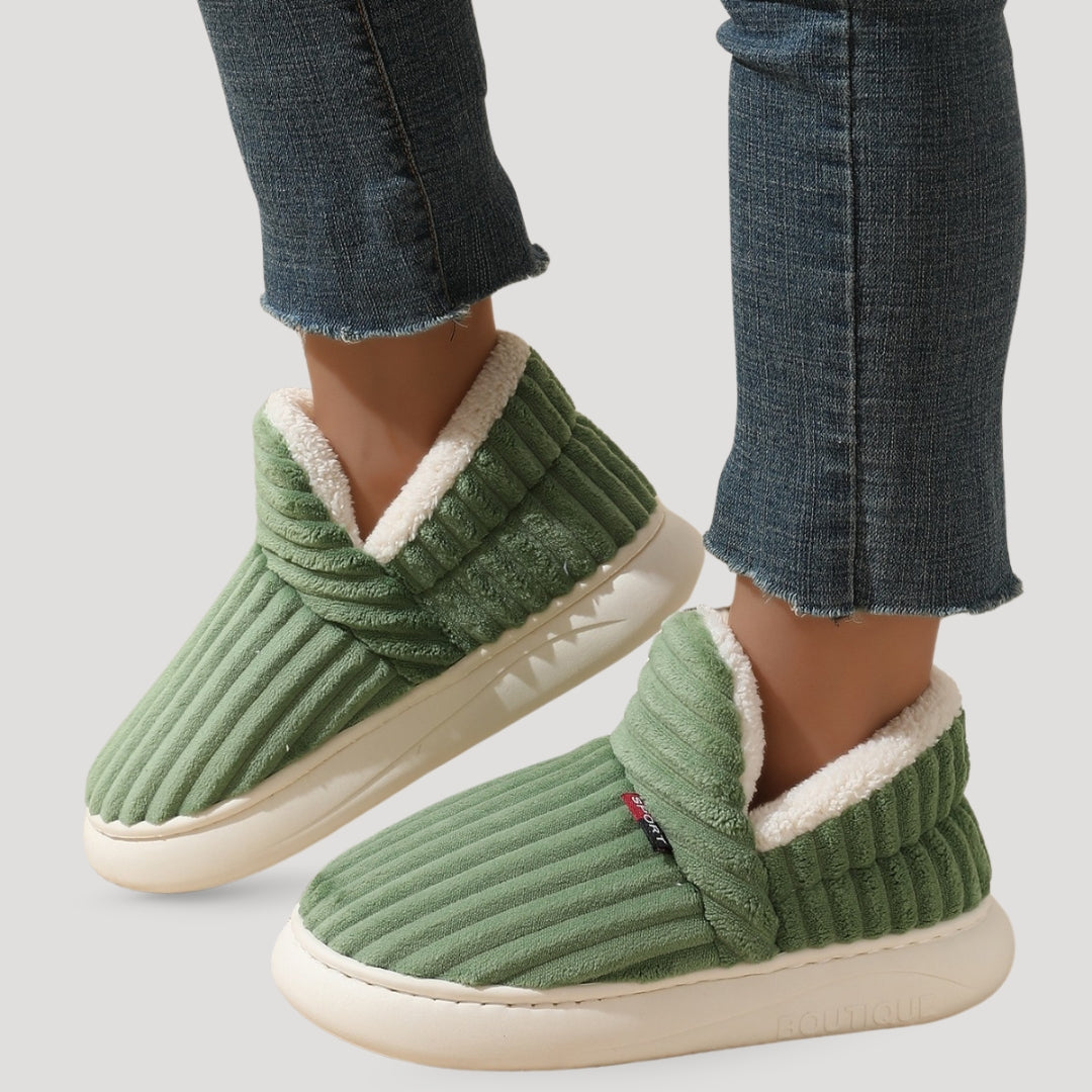 Fleece-lined women's slipper boots in soft pink with cozy design. 4