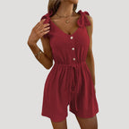 Dam byxdress kort ärmlös knappar elegant stil modern passform