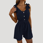 Dam byxdress kort ärmlös knappar elegant stil modern passform