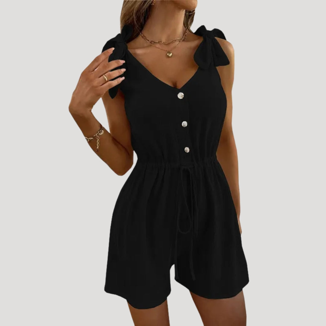 Dam byxdress kort ärmlös knappar elegant stil modern passform