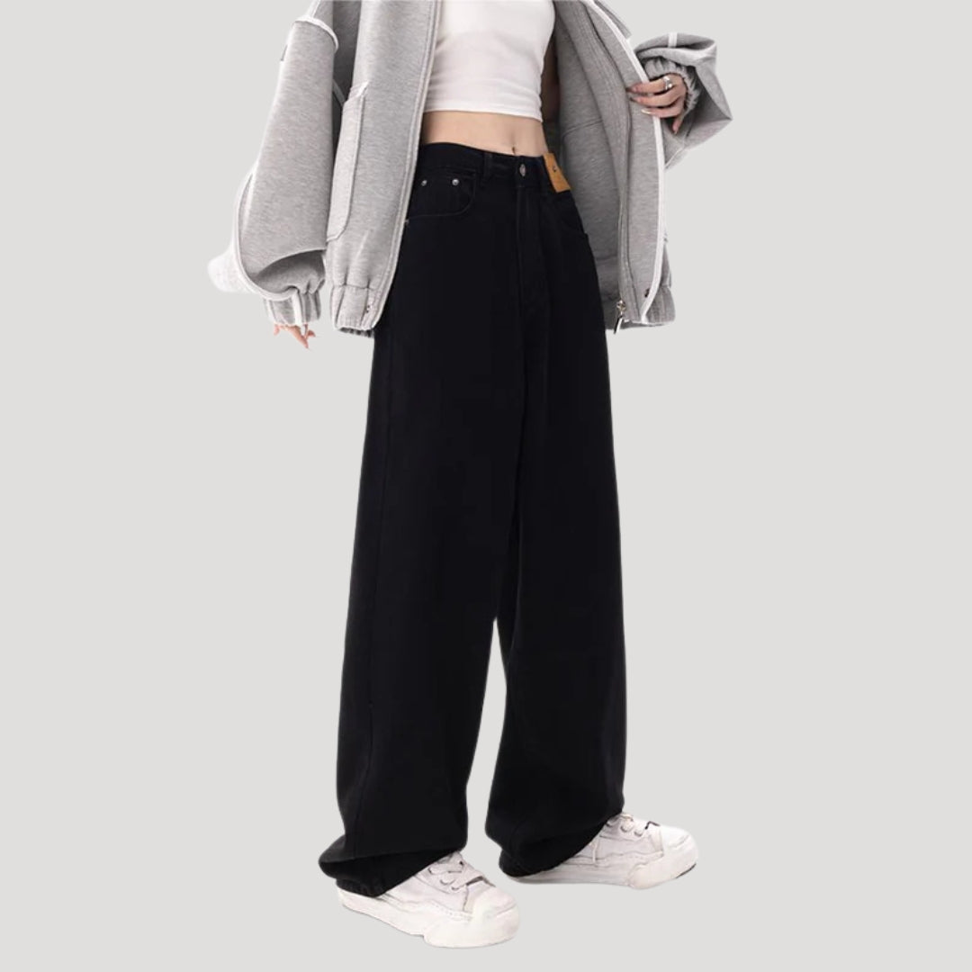 Dam högmidjade svarta vida denimjeans med breda ben och lös passform