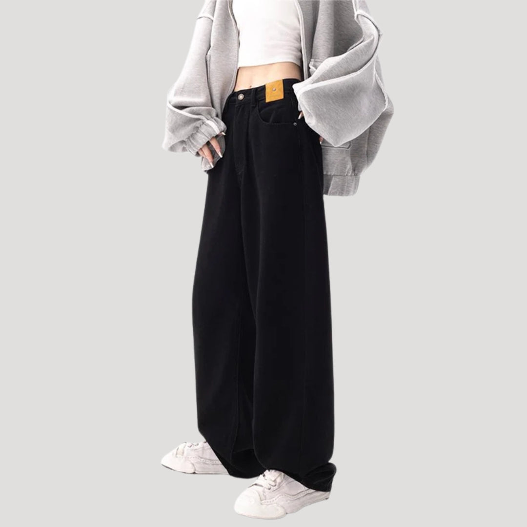 Dam högmidjade svarta vida denimjeans med breda ben och lös passform