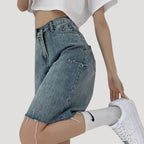 Dam jeansshorts i bermudamodell med rå kant
