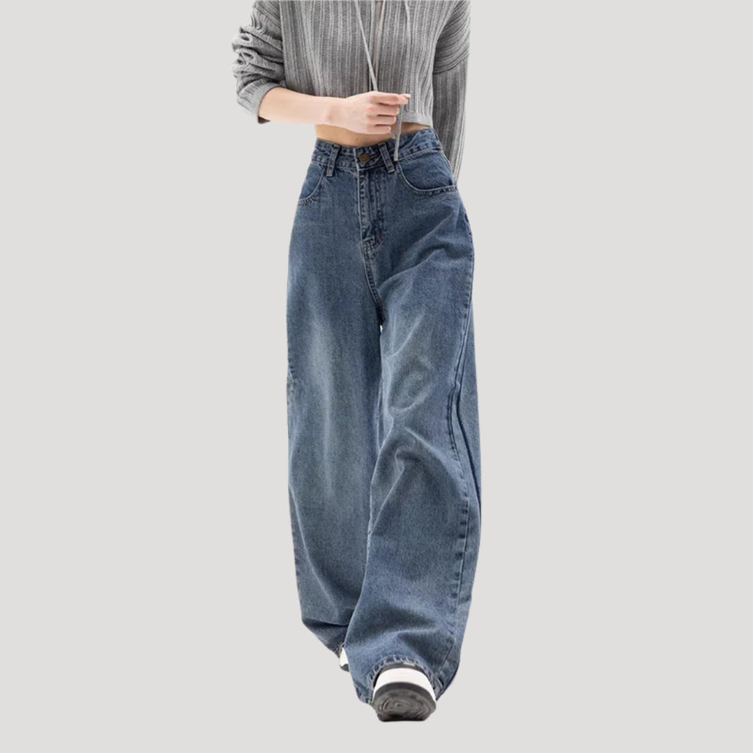 Dam högmidjade vida blå denimjeans med breda ben och ledig passform