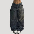Dam svarta baggy jeans med tryck och vida ben