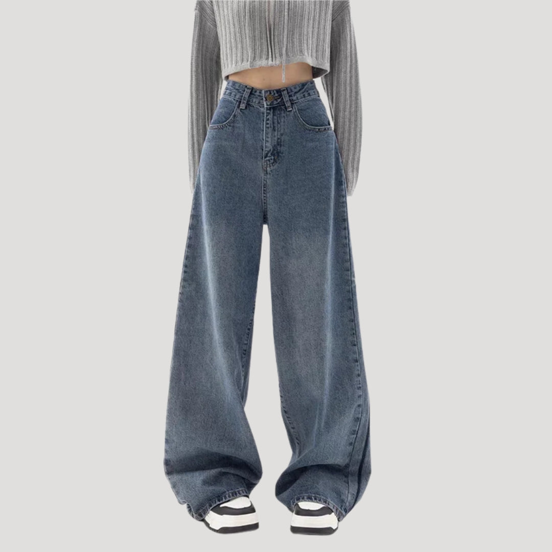 Dam högmidjade vida blå denimjeans med breda ben och ledig passform