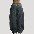 Dam svarta baggy jeans med tryck och vida ben