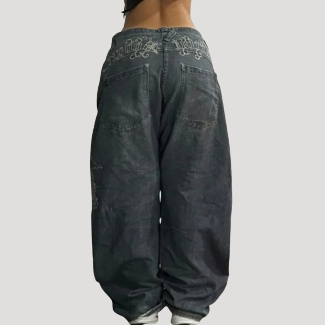 Dam svarta baggy jeans med tryck och vida ben