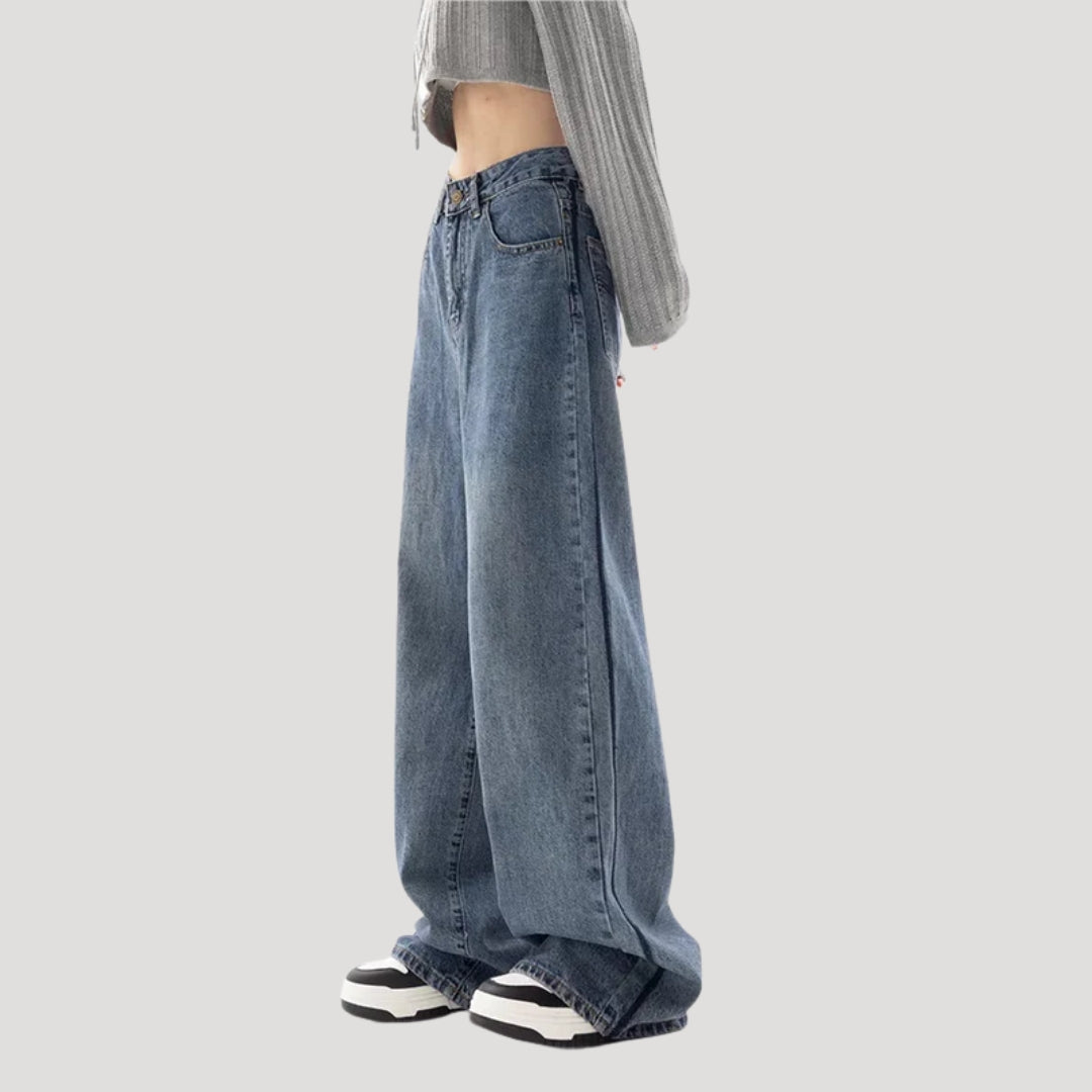 Dam högmidjade vida blå denimjeans med breda ben och ledig passform