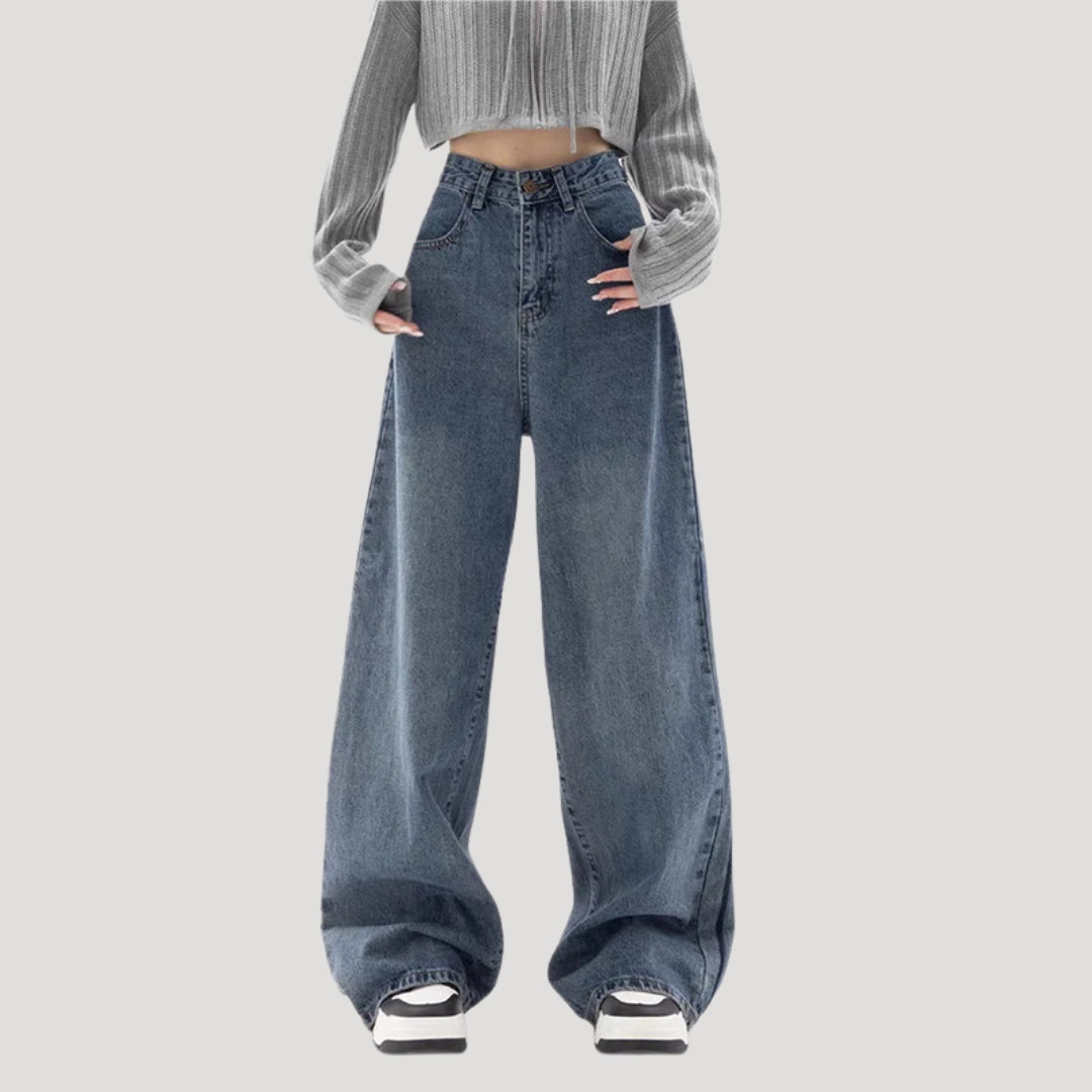 Dam högmidjade vida blå denimjeans med breda ben och ledig passform