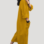 Dam långärmad jumpsuit byxdress midi längd elegant passform