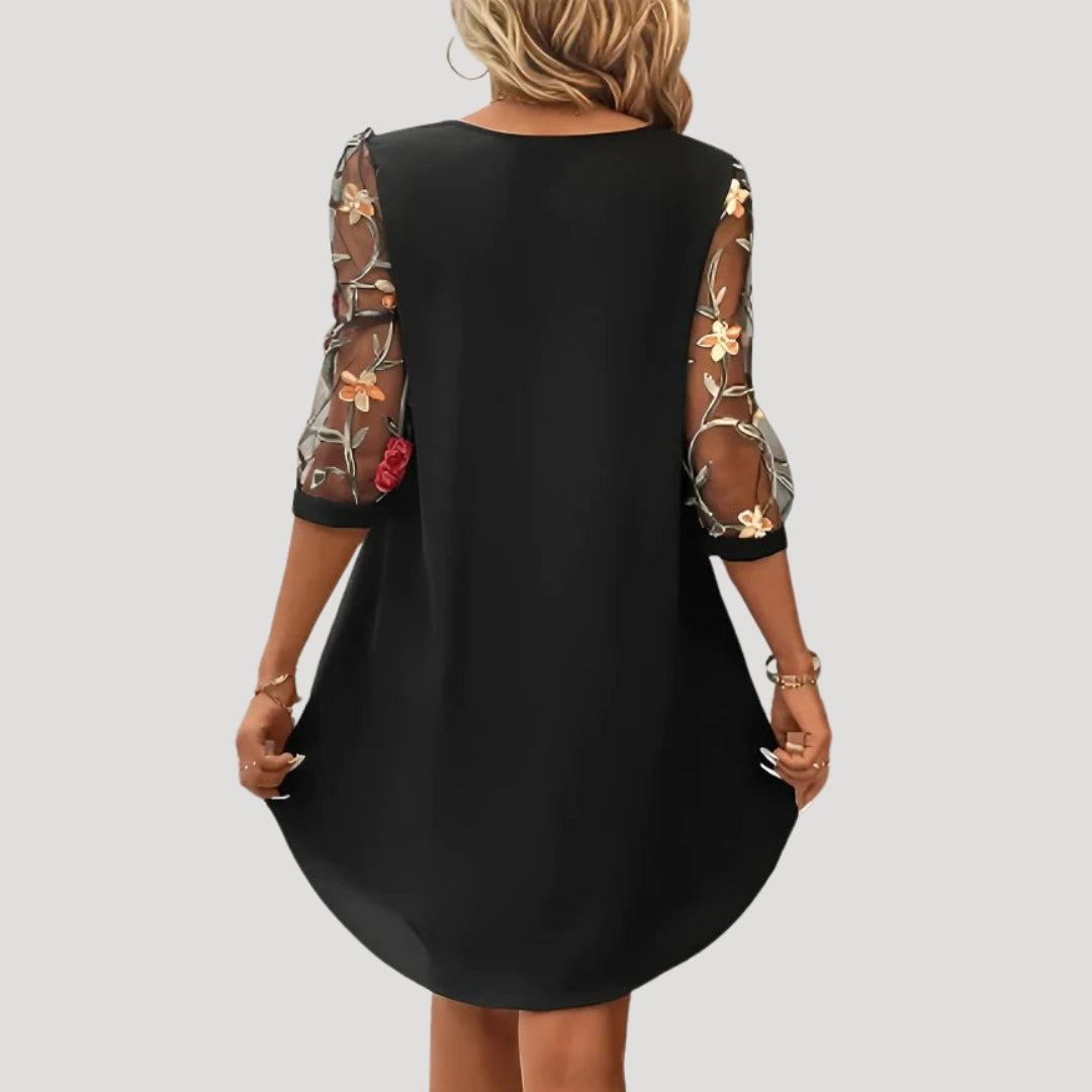 Dam långärmad klänning med broderade ärmar elegant stil