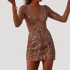 Dam v ringad paljettklänning med lång ärm