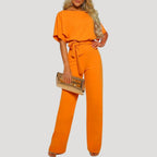 Dam jumpsuit med kort ärm och knytband