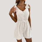 Dam byxdress kort ärmlös knappar elegant stil modern passform