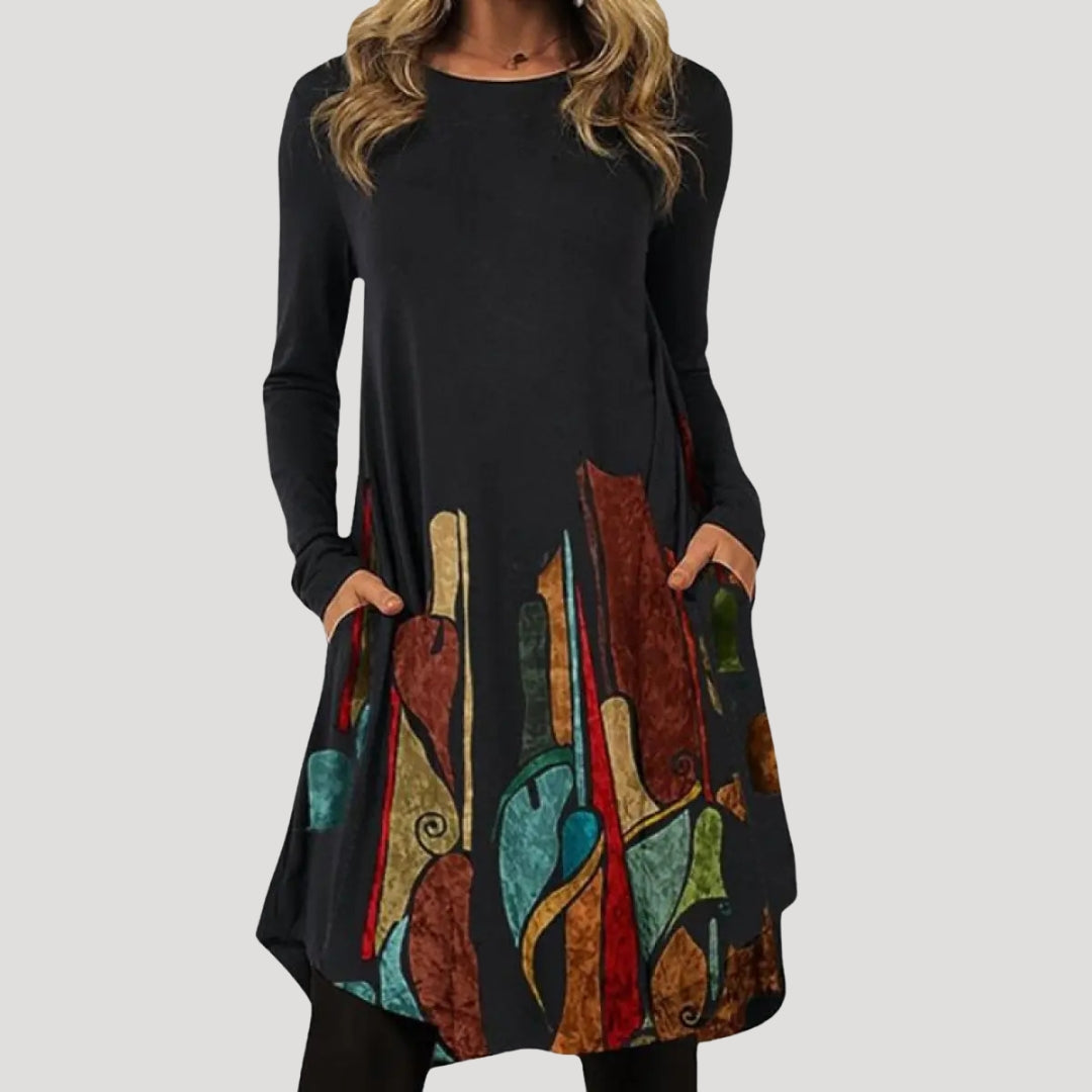 Dam långärmad tunikaklänning med mönstrad nederdel och fickor stilren