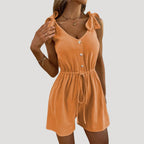 Dam byxdress kort ärmlös knappar elegant stil modern passform