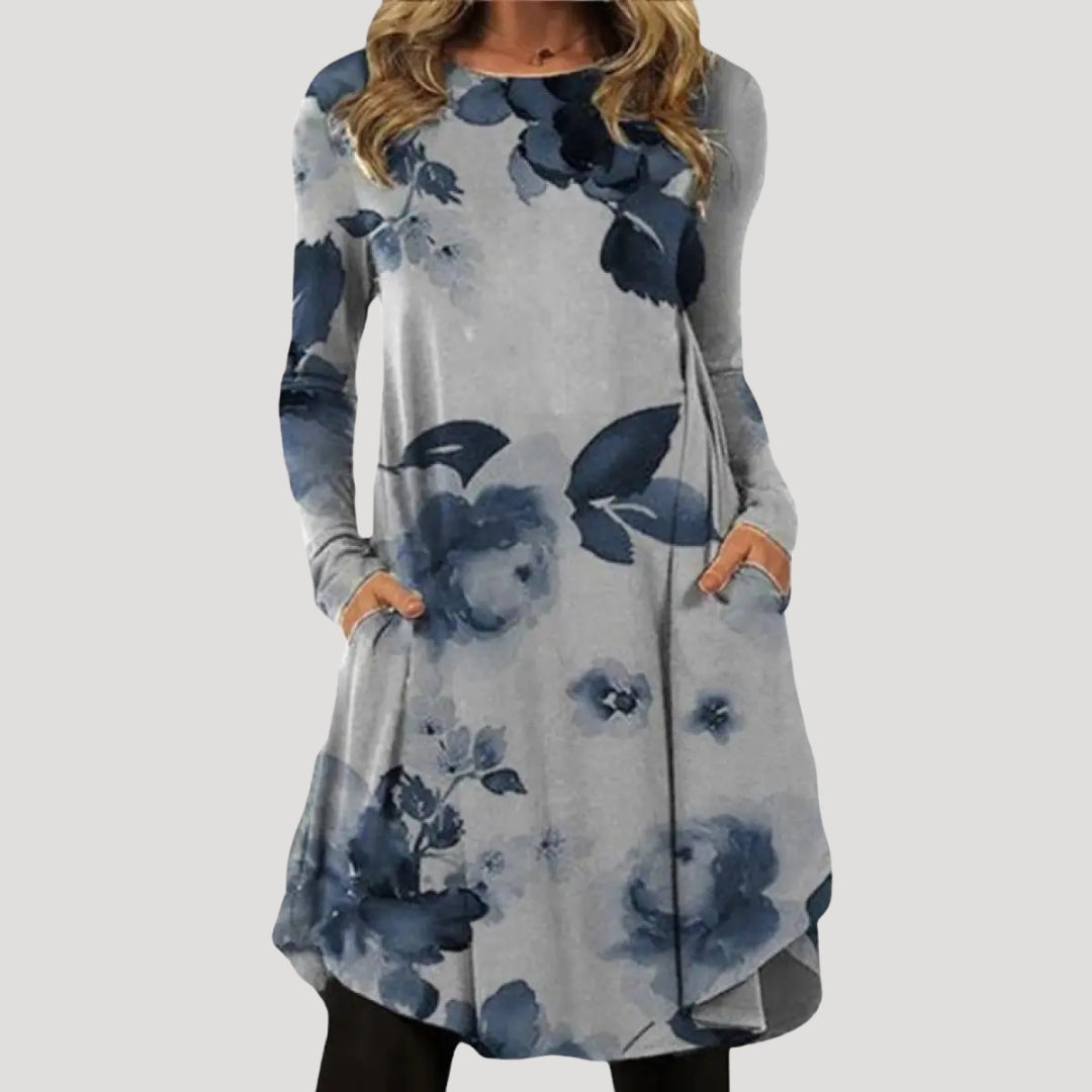 Dam långärmad tunikaklänning med mönstrad nederdel och fickor stilren