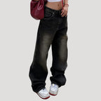 Dam svarta baggy jeans med vida ben och låg midja