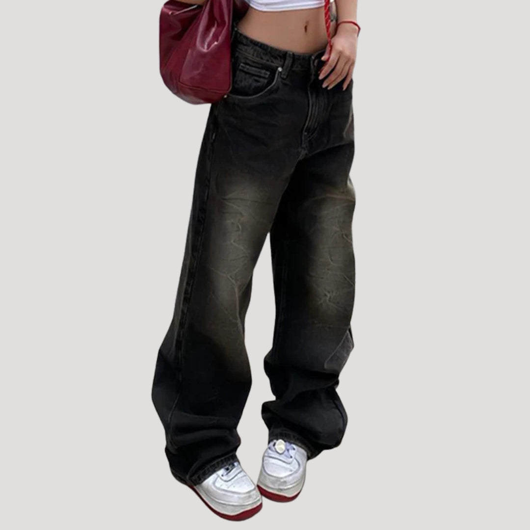 Dam svarta baggy jeans med vida ben och låg midja