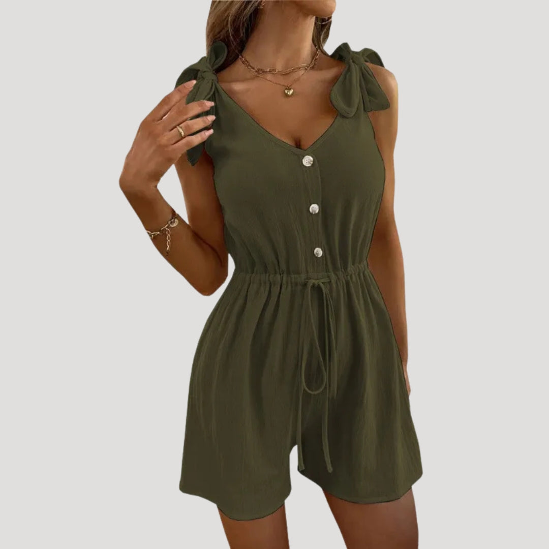 Dam byxdress kort ärmlös knappar elegant stil modern passform