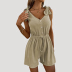 Dam byxdress kort ärmlös knappar elegant stil modern passform