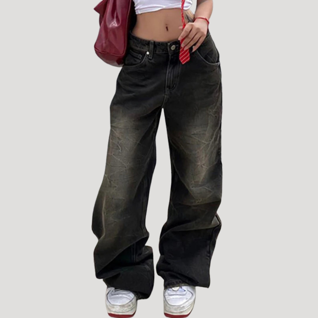 Dam svarta baggy jeans med vida ben och låg midja